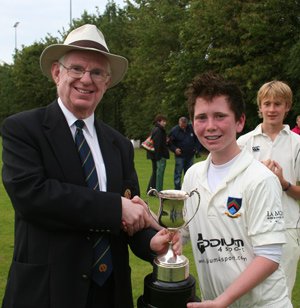 NCU President Dr Murray Power presents the Banoge Cup to winning captain Paddy Beverland ©John Boomer/CricketEurope